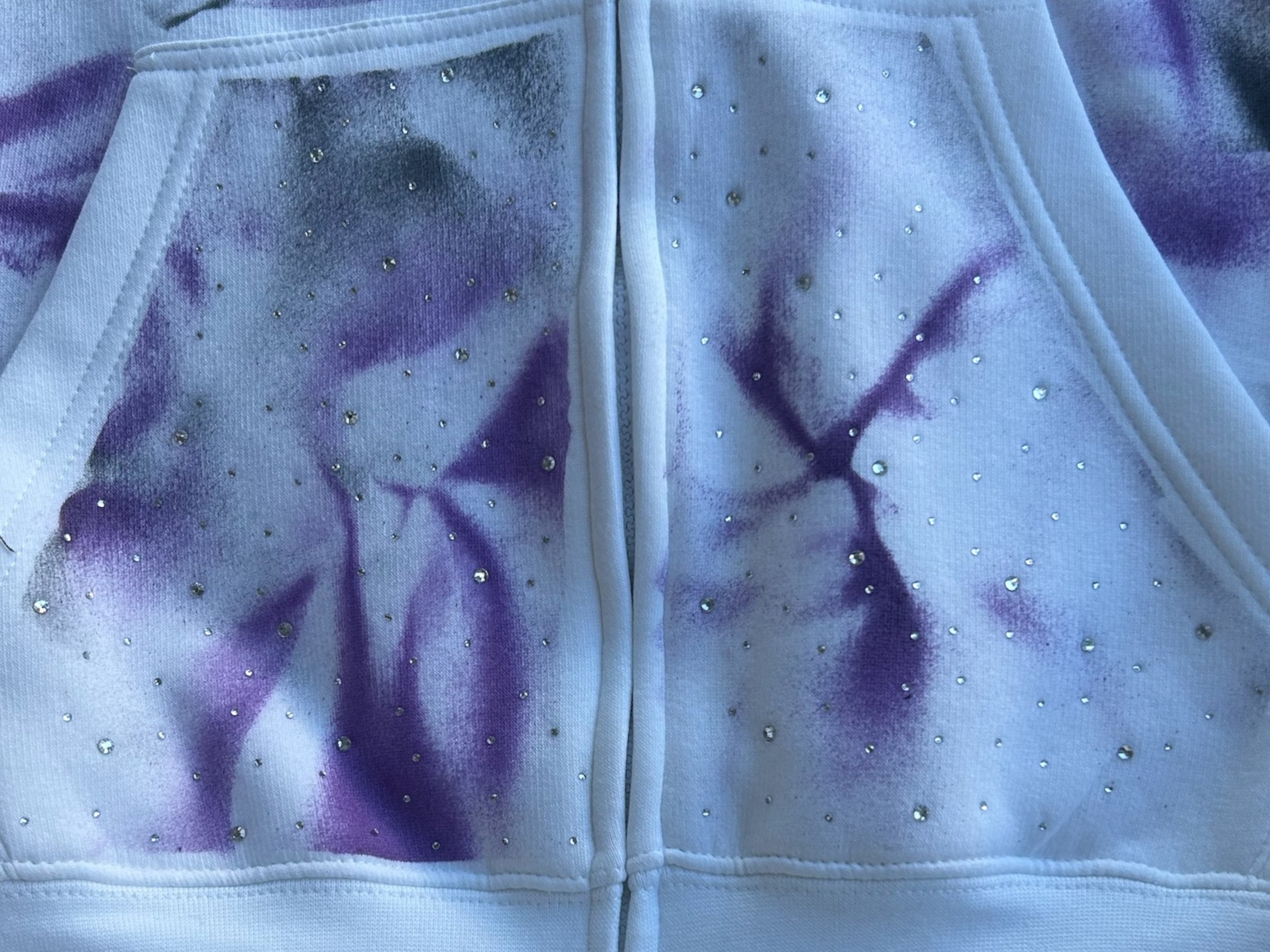 Her offset threads hustle more hoodie